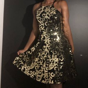 A black and gold homecoming dress